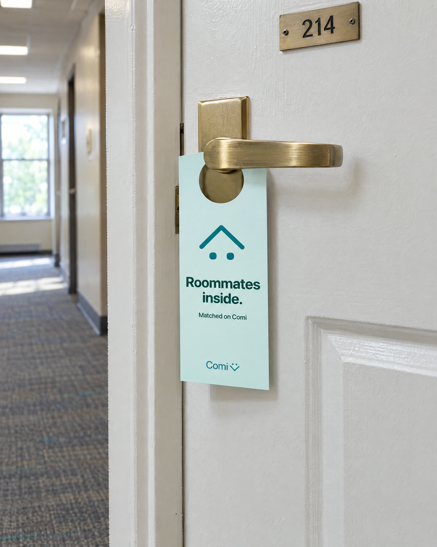 Roommates inside door hanger on a dorm room door