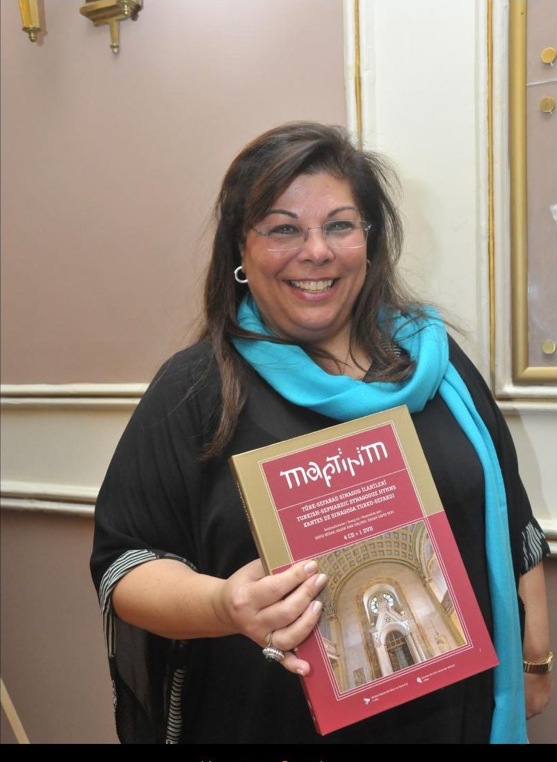 Karen Sarhon holding the Maftirim book — Istanbul