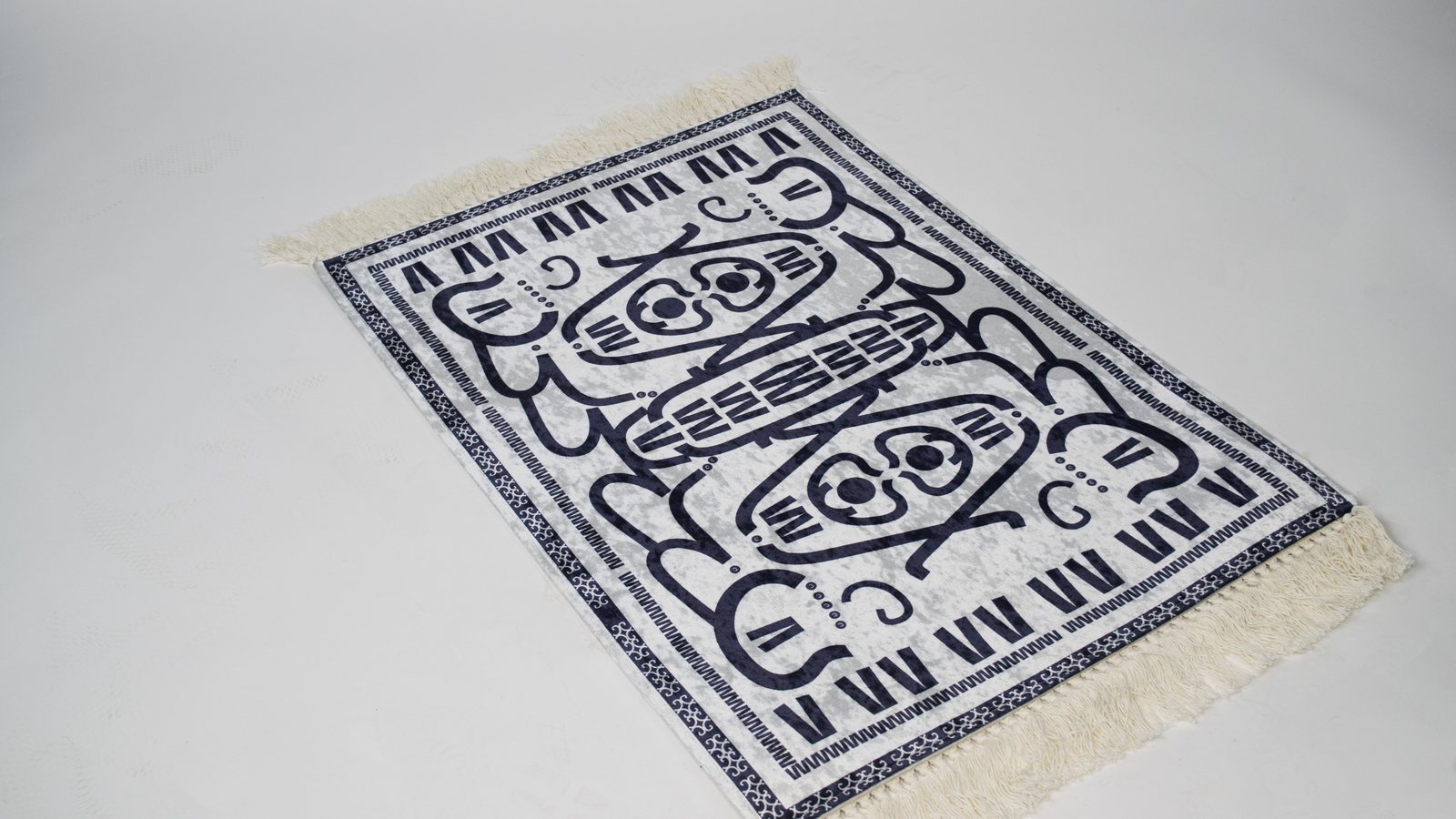 The woven Ganchos rug on the studio floor