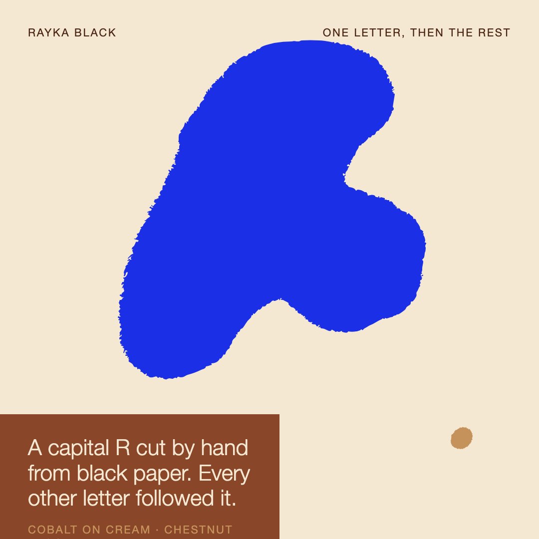 Rayka Black — 'One letter, then the rest' graphic, cobalt R on cream