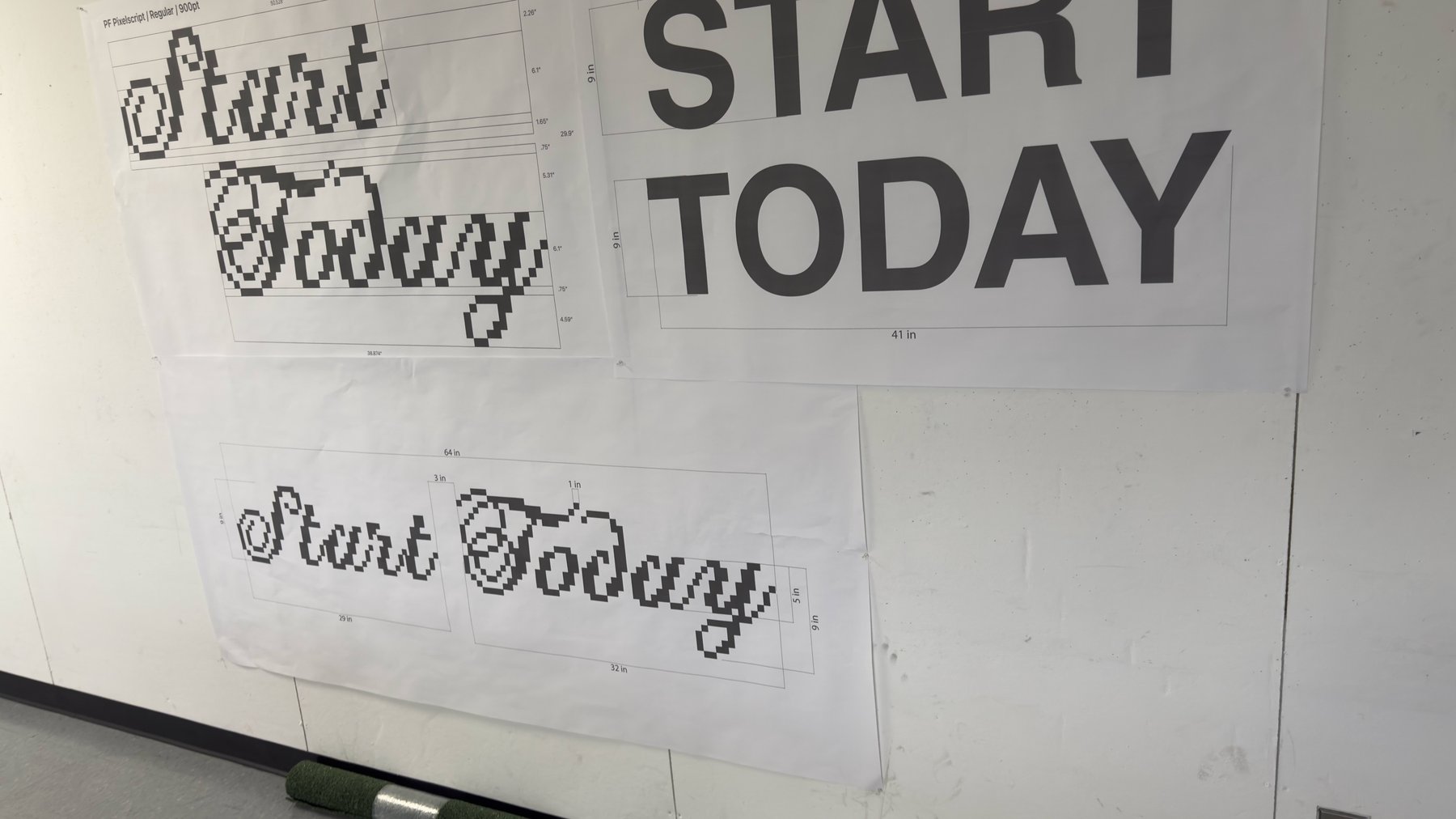 Blueprints on the wall with turf rolls